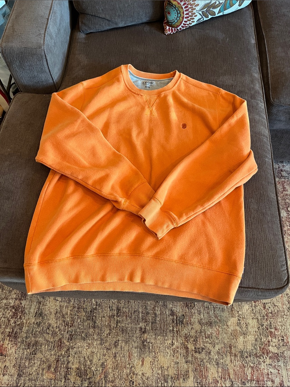 Izod pre loved crew neck sweatshirt color is a faded orange